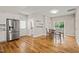 Bright dining area featuring stainless steel refrigerator, hardwood floors, and access to the backyard at 225 East End Ave, Durham, NC 27703