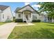 Charming home with a covered front porch, neat landscaping, and a welcoming entrance at 225 East End Ave, Durham, NC 27703