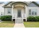 Close-up of the front porch with classic white railings and a welcoming entrance at 225 East End Ave, Durham, NC 27703