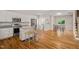 Kitchen and living area featuring hardwood floors, stainless appliances at 225 East End Ave, Durham, NC 27703