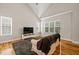 Bright and airy living room with a vaulted ceiling and hardwood flooring at 225 East End Ave, Durham, NC 27703