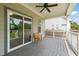 Covered back porch with ceiling fan, sliding glass doors, wood flooring, and backyard view at 225 East End Ave, Durham, NC 27703