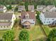 Aerial view of the home showcasing the backyard, screened porch, and neighborhood at 2256 Toad Hollow Trl, Apex, NC 27502