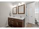 Bathroom with double sinks, granite counters, and tile flooring at 2256 Toad Hollow Trl, Apex, NC 27502