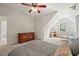 Comfortable bedroom featuring neutral tones, a ceiling fan, and natural light from a window at 2256 Toad Hollow Trl, Apex, NC 27502