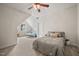 Spacious bedroom with carpet flooring, a ceiling fan, and ample natural light at 2256 Toad Hollow Trl, Apex, NC 27502