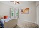 Cozy bedroom with one bed, neutral walls, carpet, and a window with natural light at 2256 Toad Hollow Trl, Apex, NC 27502