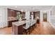 Gourmet kitchen with stainless steel appliances, granite countertops, and a large center island with seating at 2256 Toad Hollow Trl, Apex, NC 27502