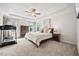 Spacious main bedroom with tray ceiling, carpeted floors, and large dresser at 2256 Toad Hollow Trl, Apex, NC 27502