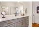 Bathroom with gray cabinets, white countertop, and modern fixtures at 2328 Sanctuary Dr, Raleigh, NC 27606