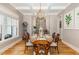 Elegant dining room with hardwood floors, a chandelier, and stylish decor for Gathering meals and gatherings at 2328 Sanctuary Dr, Raleigh, NC 27606