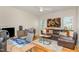 Well-lit home office with a desk setup, comfortable seating, and a unique art piece, perfect for productivity at 2328 Sanctuary Dr, Raleigh, NC 27606