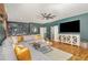 Inviting living room with hardwood floors, modern bar, and an open layout at 2328 Sanctuary Dr, Raleigh, NC 27606
