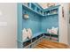 Charming mudroom with built-in storage, cubbies, bench seating and custom blue cabinets at 2328 Sanctuary Dr, Raleigh, NC 27606