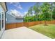 Home exterior featuring a spacious backyard at 2619 Bordwell Grant Dr, New Hill, NC 27562