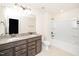 Bathroom featuring double vanity with granite countertops and bathtub shower at 2619 Bordwell Grant Dr, New Hill, NC 27562