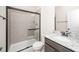 Modern bathroom features a glass shower, tile surround, and granite vanity at 2619 Bordwell Grant Dr, New Hill, NC 27562