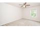 Neutral toned bedroom with plush carpet and ceiling fan at 2619 Bordwell Grant Dr, New Hill, NC 27562