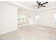 Spacious bedroom featuring plush carpeting, a modern ceiling fan, and recessed lighting at 2619 Bordwell Grant Dr, New Hill, NC 27562