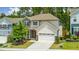 Charming two-story home with manicured lawn, stone accents, and a two-car garage boosts curb appeal at 2619 Bordwell Grant Dr, New Hill, NC 27562