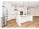 Bright kitchen features stainless steel appliances, white cabinets, and granite countertops at 2619 Bordwell Grant Dr, New Hill, NC 27562