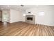 Spacious living room with wood floors, a fireplace, and plenty of natural light at 2619 Bordwell Grant Dr, New Hill, NC 27562