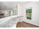 Bright home office with granite counters, built-in desk, and a window at 2619 Bordwell Grant Dr, New Hill, NC 27562
