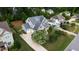 Aerial view of the home with lush landscaping and driveway at 2661 Silver Bend Dr, Apex, NC 27539