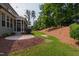 Large backyard with patio area, landscaping, grass and mulched areas at 2661 Silver Bend Dr, Apex, NC 27539