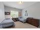 This comfortable bedroom offers two beds, decor and neutral paint at 2661 Silver Bend Dr, Apex, NC 27539
