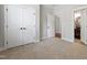 Neutral bedroom with closet and view of a modern half bathroom at 2661 Silver Bend Dr, Apex, NC 27539