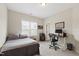 Cozy bedroom with carpet, natural light, and an office area with desk and computer at 2661 Silver Bend Dr, Apex, NC 27539