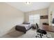 This spare bedroom offers a single bed, desk and neutral paint at 2661 Silver Bend Dr, Apex, NC 27539