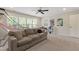Large bonus room with a comfortable sofa, a basketball hoop game and natural light at 2661 Silver Bend Dr, Apex, NC 27539