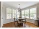 Cozy breakfast nook with natural light from windows and elegant chandelier lighting at 2661 Silver Bend Dr, Apex, NC 27539