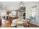 Open floor plan with kitchen view into the breakfast nook, hardwood floors, and modern lighting at 2661 Silver Bend Dr, Apex, NC 27539
