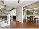 Spacious home featuring dining room, hardwood flooring, staircase, and open layout to the kitchen at 2661 Silver Bend Dr, Apex, NC 27539