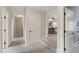 Hallway that transitions into a bonus room with seating and a basketball hoop game at 2661 Silver Bend Dr, Apex, NC 27539