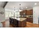 Open kitchen with granite countertops and stainless steel appliances at 2661 Silver Bend Dr, Apex, NC 27539