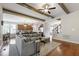 Open floor plan featuring living room and kitchen with hardwood flooring and natural light at 2661 Silver Bend Dr, Apex, NC 27539