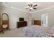 This spacious main bedroom features a tray ceiling, neutral paint and plush carpet floors at 2661 Silver Bend Dr, Apex, NC 27539