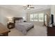 This spacious main bedroom features a tray ceiling, carpet floors and plentiful natural light at 2661 Silver Bend Dr, Apex, NC 27539