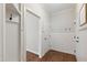 Mudroom with white wainscoting, coat hooks, and hardwood floors at 2661 Silver Bend Dr, Apex, NC 27539