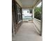 Covered porch and stone facade with a view of the detached garage at 2661 Silver Bend Dr, Apex, NC 27539