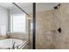 This bright bathroom features a frameless shower, tile surround and glass accents at 2661 Silver Bend Dr, Apex, NC 27539