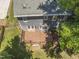 Aerial view of the home showcasing the deck, backyard, and surrounding greenery at 2708 Halfhitch Trl, Raleigh, NC 27615