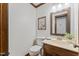 Updated bathroom with wood vanity and mirror frame, toilet and neutral paint at 2708 Halfhitch Trl, Raleigh, NC 27615
