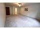 Spacious bedroom with ensuite access, neutral carpeting, and walk-in closet at 2708 Halfhitch Trl, Raleigh, NC 27615