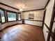 Bright dining room with hardwood floors, large windows, and stylish light fixture at 2708 Halfhitch Trl, Raleigh, NC 27615