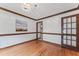 Dining room with hardwood floors and dark trim; view to kitchen and front hallway at 2708 Halfhitch Trl, Raleigh, NC 27615